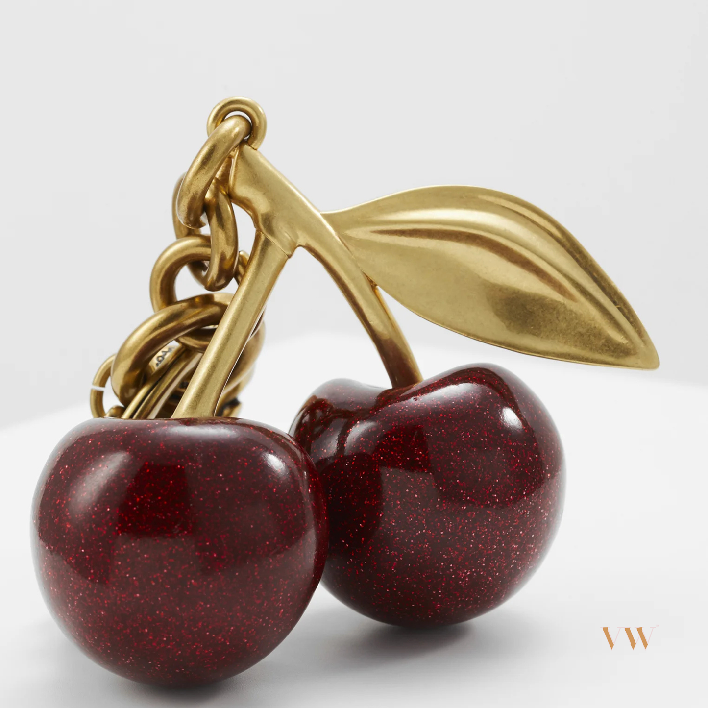 Coach cherry charm gold and red