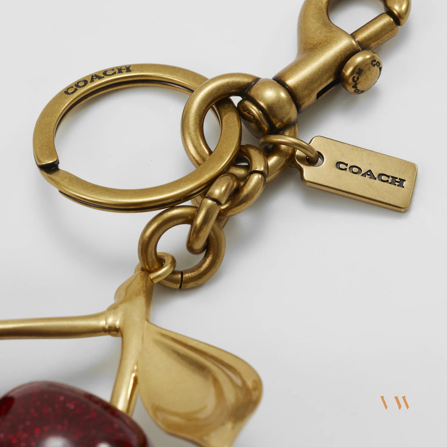 Coach cherry charm gold and red
